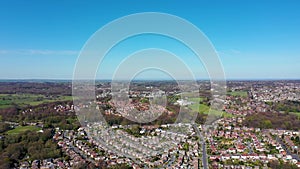 Aerial footage of the British town of Meanwood in Leeds West Yorkshire showing typical UK housing estates and rows of houses from