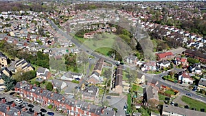 Aerial footage of the British town of Meanwood in Leeds West Yorkshire showing typical UK housing estates and rows of houses from