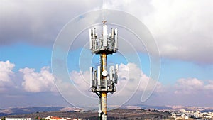 Aerial footage Close to cellular Antenna with blue sky and Clouds