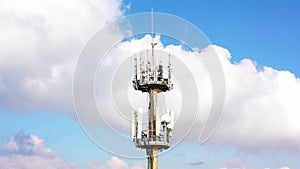 Aerial footage Close to cellular Antenna with blue sky and Clouds