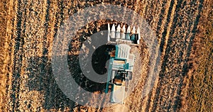 Aerial footage of farmer using combine harvester and working the fields