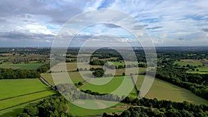 Aerial footage flying over countryside towards Leeds