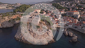 Aerial footage of a fort tower near Dubrovnik in Croatia, view from drone from the sea.