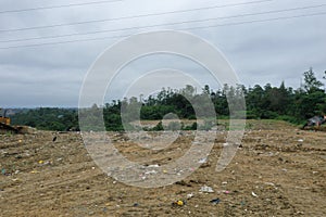 Aerial footage of a garbage landfill, showing the trash piled up