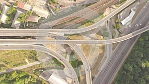 Aerial footage of highway and overpass with cars and trucks.