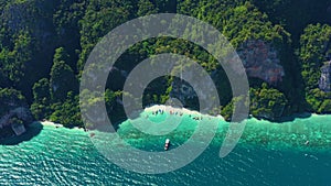 Aerial footage of Koh Phi Phi Don Western Ton Sai bay cliffs overlooking crystal clear bay near monkey beach