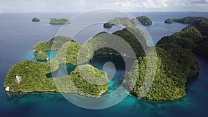 Aerial footage of a limestone islands in Rock Islands, Palau.