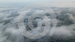 Aerial footage low fog clouds Kuala Lumpur city skyline.