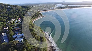 Aerial footage of Main Beach Noosa Heads with surfers