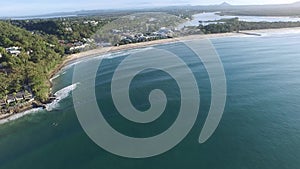 Aerial footage of Main Beach Noosa Heads with surfers