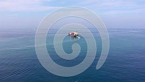 Aerial footage over Container Cargo Ship Sailinig in Mediterranean Sea