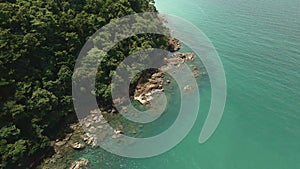 aerial footage of rocky tropical coastline