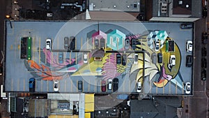 Aerial footage of roof parking place in Toronto with graffiti eagle