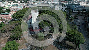 Aerial footage of Saint Michael`s Church hidden behind trees Bridgetown, Barbados