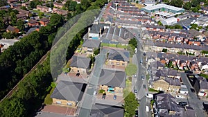 Aerial Footage of the town of Knottingley in Wakefield in the UK showing the British suburban housing estates in the summer time