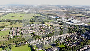Aerial footage of the UK town known as Pontefract, located in Wakefield West Yorkshire, showing typical British housing estates
