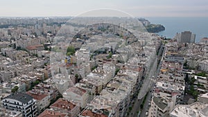 Aerial footage of vast housing estate near sea coast. Fly over apartment buildings in residential urban borough in city