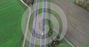 Aerial footage of vehicles driving on a highway