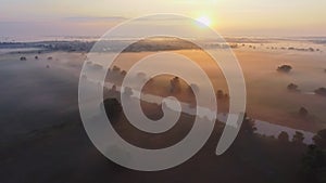 Aerial footage video of foggy morning. Flying over the Desna river. Sunrise time. Kyiv region, Ukraine.
