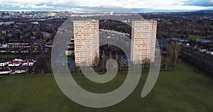 Aerial footage view of high rise tower blocks, flats built in the city of Glasgow to accommodate the increasing population,