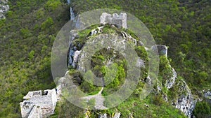 Aerial forward video of ruins of the old fortress Sokograd, amazing view of green vegetation