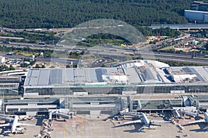 aerial of Frankfurt international airport with view to modern terminal and aircrafts at apron