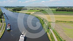 Aerial from freighters cruising in the countryside on Princes Margriet canal near Lemmer in the Netherlands