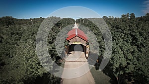 Aerial front view of Caine road covered bridge in Ashtabula County Ohio, USA