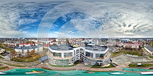 aerial full seamless spherical 360 hdri panorama view in city overlooking of residential area of high-rise buildings in