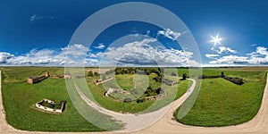 aerial full seamless spherical hdri 360 panorama over ruined palace, abandoned outbuildings and gravel road in equirectangular