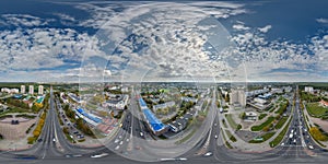 aerial full seamless spherical hdri 360 panorama view above road junction with traffic in city overlooking of residential area of