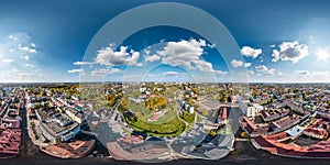 aerial full seamless spherical hdri 360 panorama view from great height on red roofs of historical center of old big city in