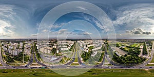 aerial full seamless spherical 360 hdri panorama view above road junction with traffic in city overlooking of residential area of photo