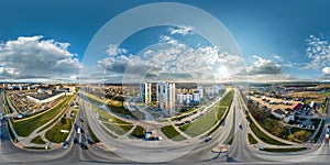 aerial full seamless spherical hdri 360 panorama view above road junction with traffic in city overlooking of residential area of photo