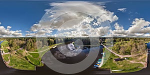 aerial full seamless spherical hdri 360 panorama view over dam lock sluice on lake impetuous waterfall with beautiful clouds in photo