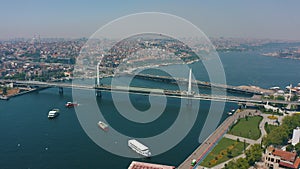 Aerial: Golden Horn Bridge, Eminonu pier, Metro train station, Istanbul