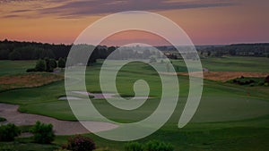 Aerial golf park sunset at cloud sky nature landscape. Golfing field background.