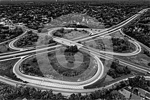 Aerial grayscale  view of highway loops and exits in the Skokie suburb from the Chicagoland area