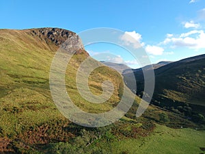 Aerial of the green mountains in the Isle of Arran, Scotland.