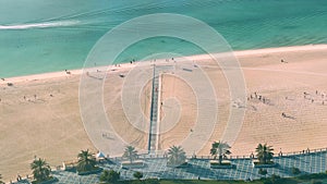 Aerial high shot of a beach - time-lapse of people having fun at a public beach - Abu Dhabi, UAE