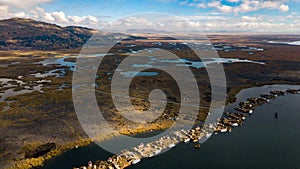 Aerial high view of Uros floating islands settlements at Lake Titicaca photo