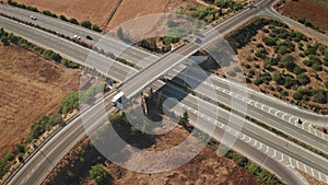 Aerial highway asphalt road junction top view. Desert nature landscape. Highway multi-level bridge