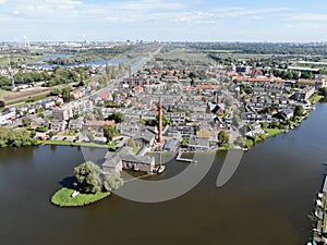 Aerial of historic steam pump station with pipe in Halfweg, the Netherlands