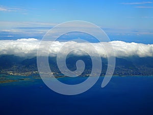 Aerial of Honolulu with clouds hovering above
