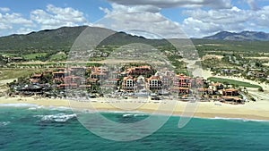 Aerial, hyper lapse, over the ocean, towards hotels and resorts, Cabo, Mexico