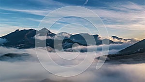 Aerial hyperlapse of beautiful foggy alps mountains landscape panorama