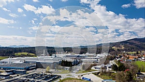 Aerial hyperlapse of dramatic cloudscape above huge industrial plant