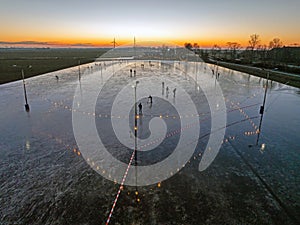 Aerial from ice skating at sunset on the ice rink in Koudum Friesland the Netherlands