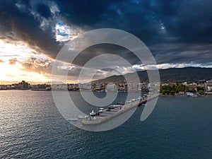 Aerial iconic sunset view over the port of Kalamata seaside city in Messenia, Greece