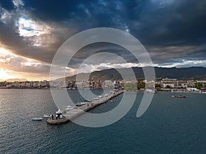 Aerial iconic sunset view over the port of Kalamata seaside city in Messenia, Greece